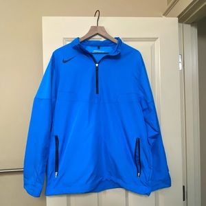 Blue Nike golf wind breaker